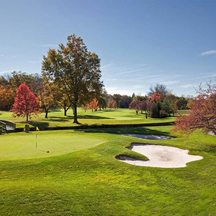 Scenic golf course view with green grass and autumn trees in Yonkers, NY