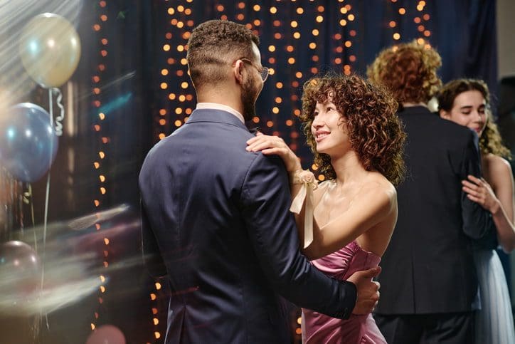 Couples slow dancing at a prom night event in Yonkers, NY